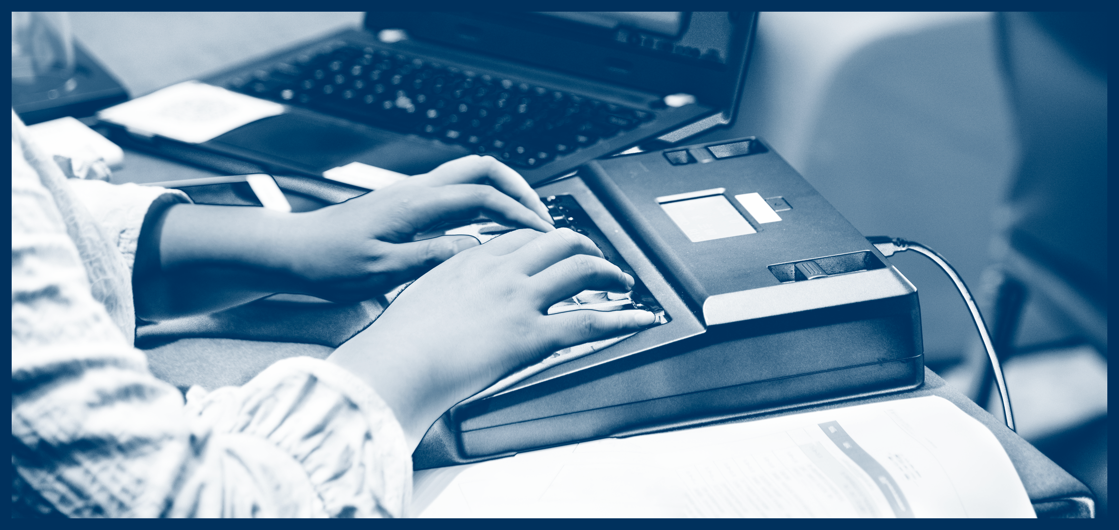 Image of a Court Reporter operating a Stenograph