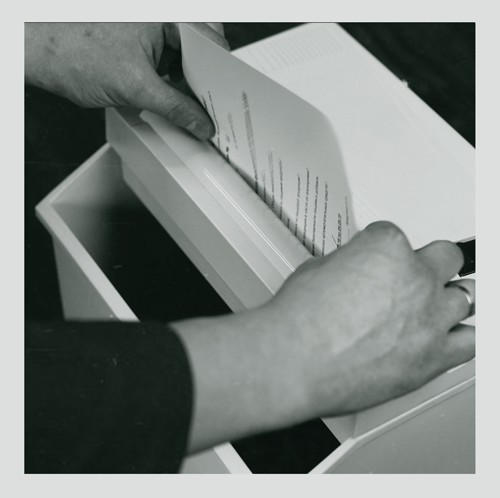 Woman shredding a document